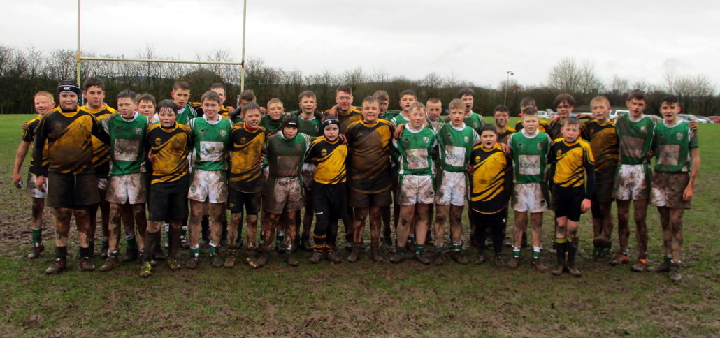 The teams after a muddy match!